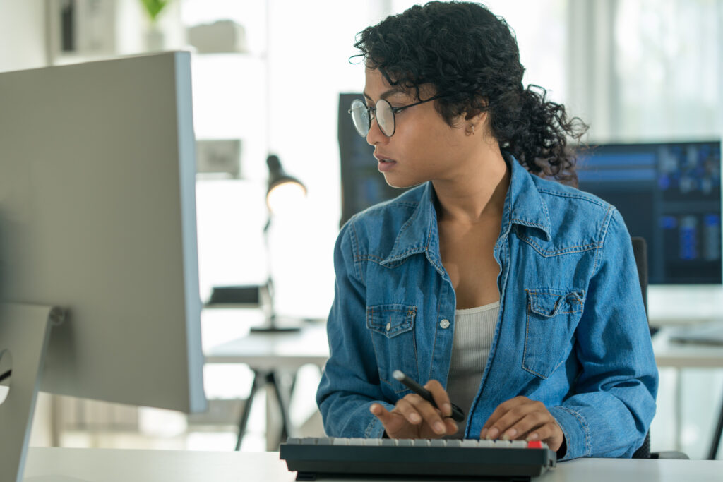 A business owner reviews the analytics from her fleet fuel card.