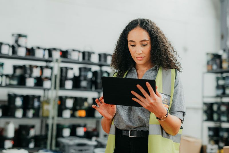 A business manager reviews data from her fleet card information.