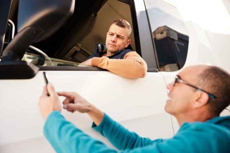 A business owner shares details of a fleet card app with his driver.
