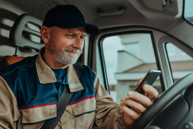 A fleet driver tracks his fuel and gas station purchases on his phone app.
